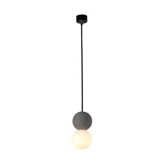 OrigoGlow: Lámpara colgante con estructura esférica de cemento y vidrio opalino – para la entrada y esquina del sofá